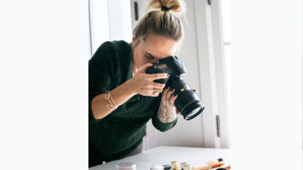 Beauty blogger taking photo of cosmetics Beauty blogger taking photo of cosmetics.